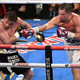 Gennadiy Golovkin hits Saul “Canelo” Alvarez in a 2018 bout.